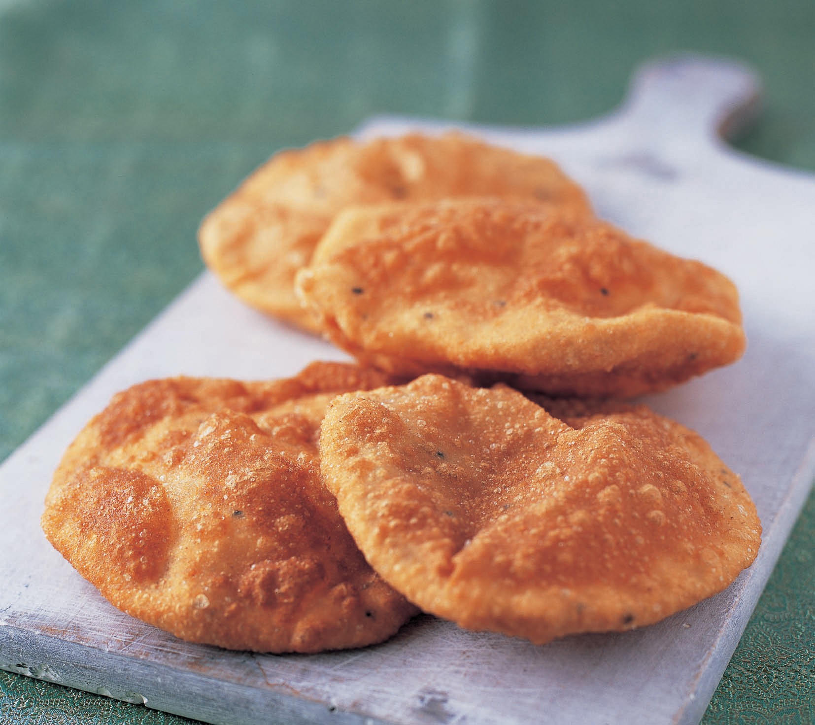 Deepfried puffed bread from The Complete Indian Regional Cookbook 300 Classic Recipes from the
